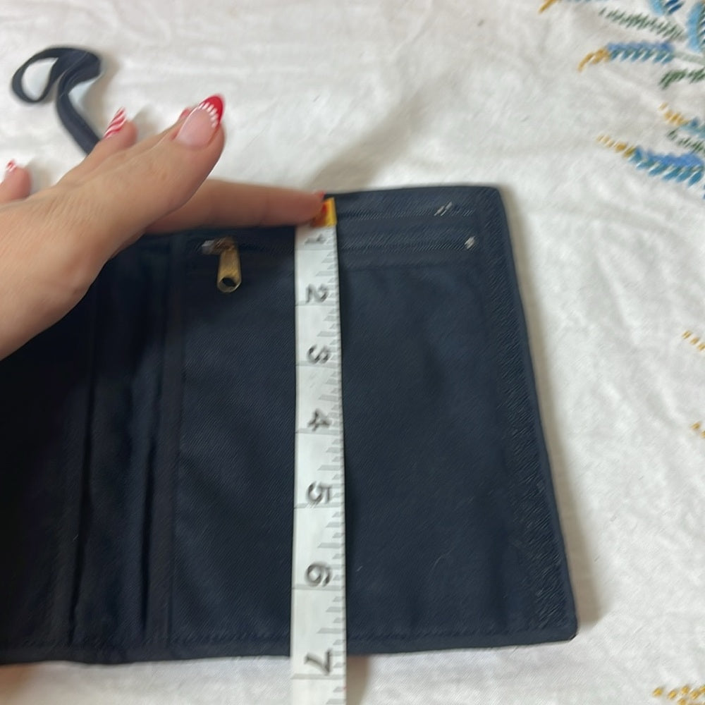 Embroidered passport holder with Velcro and multiple zippers featuring Peacock