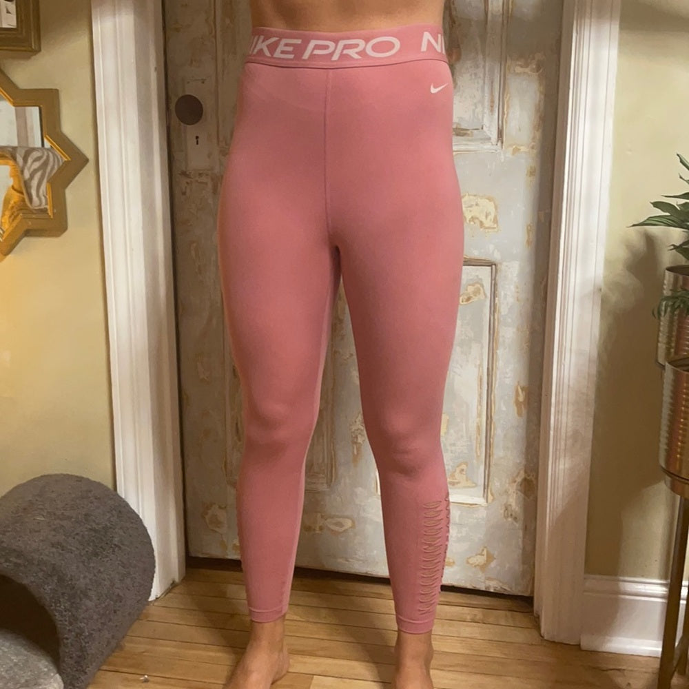 Bundle Nike & under Armour pink and purple leggings. Size M