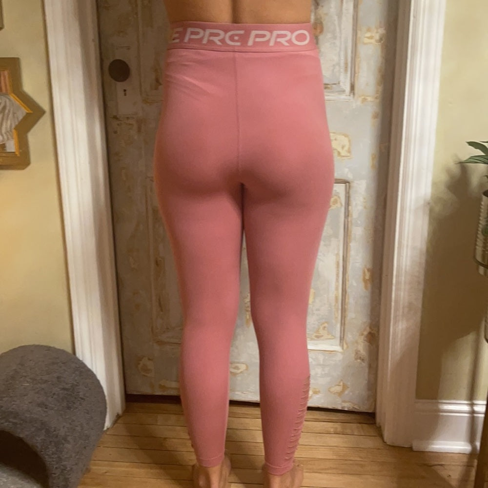 Bundle Nike & under Armour pink and purple leggings. Size M