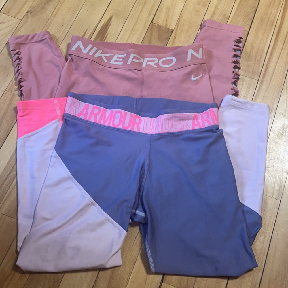 Bundle Nike & under Armour pink and purple leggings. Size M