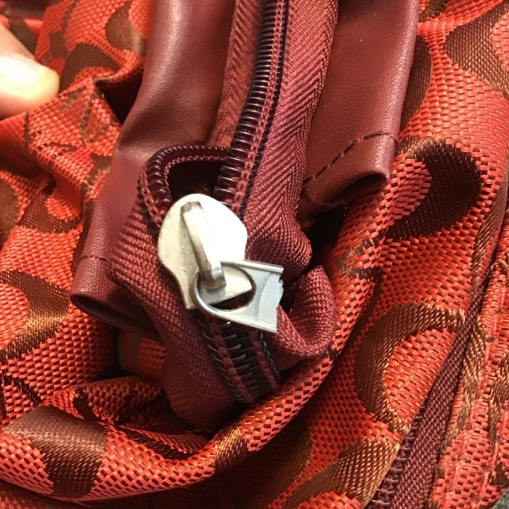China town G travel bag red and maroon.