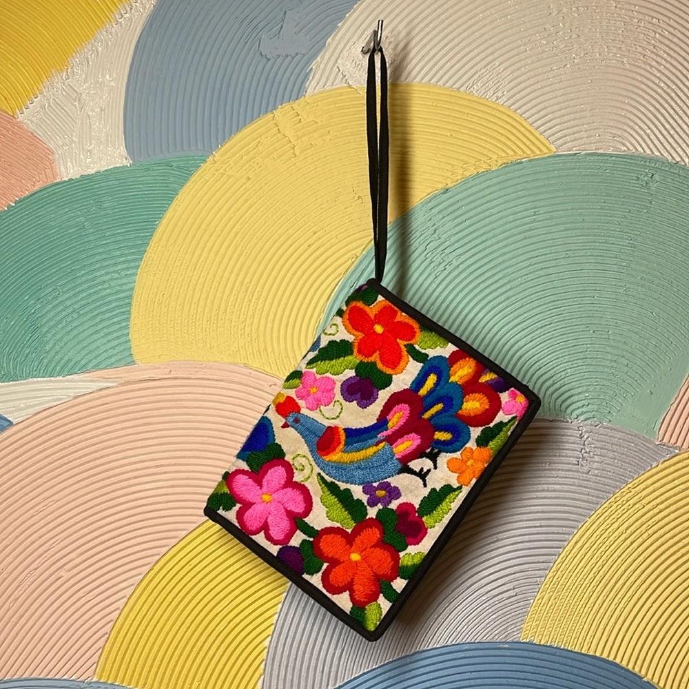 Embroidered passport holder with Velcro and multiple zippers featuring Peacock